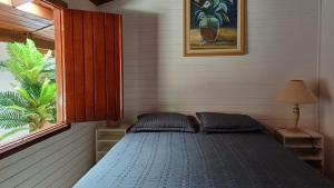 Postel nebo postele na pokoji v ubytování Sítio Encontro das Águas Brotas