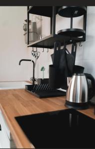 a kitchen counter with a tea kettle on a counter top at Castle View Appartment in Nuremberg