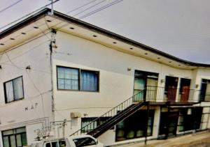 a white house with a car parked in front of it at M,AP - Vacation STAY 16056 in Otaru