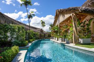 a swimming pool in front of a resort at TAKUMA BOUTIK HOTEL in Las Terrenas