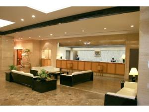 a lobby with couches and a waiting room at Hotel Nagoya Garden Palace - Vacation STAY 25771v in Nagoya