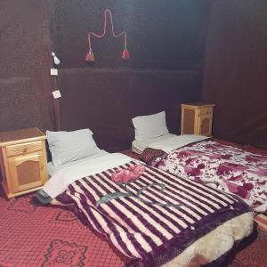 Postel nebo postele na pokoji v ubytování RestCamp ErgChebbi