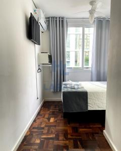 TV a/nebo společenská místnost v ubytování Hotel Lara 10 Curitiba