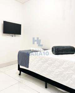 Postel nebo postele na pokoji v ubytování Hotel Lara 10 Curitiba
