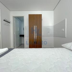Postel nebo postele na pokoji v ubytování Hotel Lara 10 Curitiba