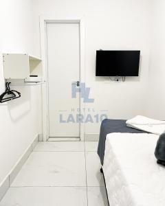 TV a/nebo společenská místnost v ubytování Hotel Lara 10 Curitiba