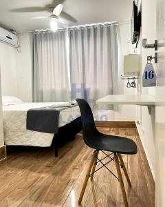Postel nebo postele na pokoji v ubytování Hotel Lara 10 Curitiba