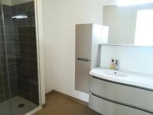 a bathroom with a sink and a shower at Résidence Coteau - Charmant appartement de 70m² dans une résidence à deux pas de la plage. MAE-6584 in Pléneuf-Val-André