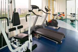 a gym with two tread machines and a window at ###SENSACIONAL### MERCURE APART HOTEL PREMIUM in Manaus
