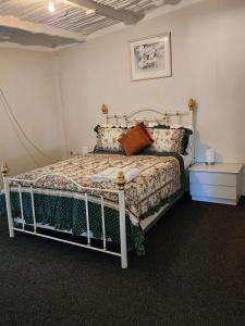 a bedroom with a bed in a room at Country Retreat The Blue Cottage in Gingin