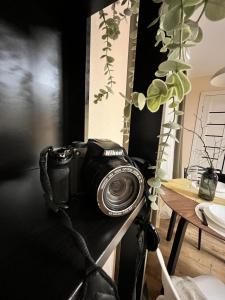 a camera sitting on a table in a room at New Charm Apartments near Border in Narva