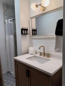 a bathroom with a sink and a shower at Three Pines Cabins in Big Bear Lake