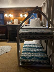 a couple of bunk beds in a room at Three Pines Cabins in Big Bear Lake