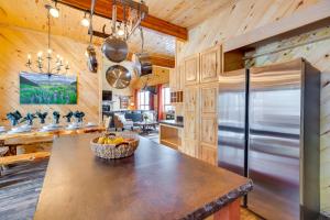 a kitchen with a large stainless steel refrigerator at Spacious Gunnison Home Ski, Hike, Bike and Fish! in Gunnison