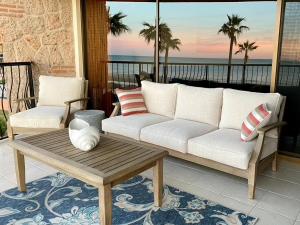 a living room with a couch and a coffee table at Sonoran Sea Resort BEACHFRONT Condo E203 in Puerto Peñasco