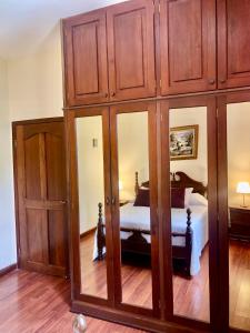Tempat tidur dalam kamar di Apartamento Mayan Plaza
