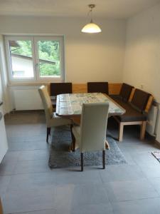 a dining room with a table and chairs at Tannenzapfen in Auffach