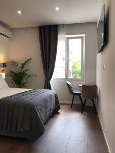 Antares Luxury Rooms 2客房内的一张或多张床位