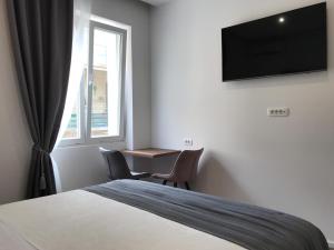 Antares Luxury Rooms 2的电视和/或娱乐中心