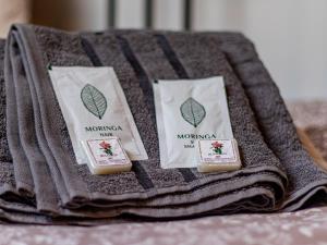 three pieces of soap on a towel on a table at Vazov Loft - Central Sofia Studio in Sofia