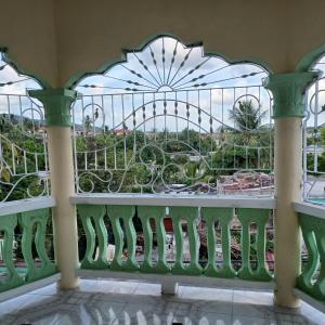 a balcony with a view of the roller coaster at 1 bdrm1 1 bath in Old Harbour