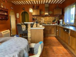 a kitchen with a bed and a counter in a room at Villa charmante à Nalliers avec piscine in Nalliers