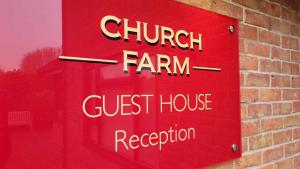 a sign for a church farm guest house reception at Church Farm Guest House in Horsford
