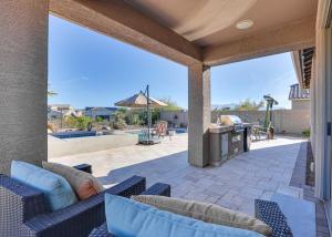 an outdoor patio with couches and a grill at Goodyear Home with Patio - Near Estrella Mountain! in Liberty