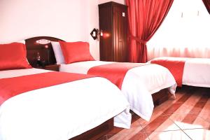 Postel nebo postele na pokoji v ubytování Hotel Plaza Victoria