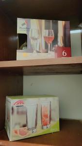 two wine glasses sitting on top of a box at F&D villas in Dar es Salaam