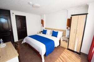 Postel nebo postele na pokoji v ubytování Hotel Plaza Victoria