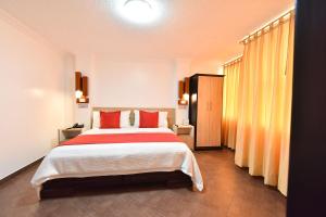 Postel nebo postele na pokoji v ubytování Hotel Plaza Victoria
