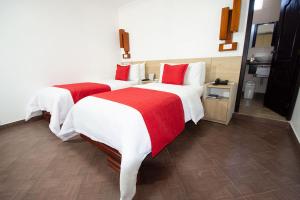 Postel nebo postele na pokoji v ubytování Hotel Plaza Victoria