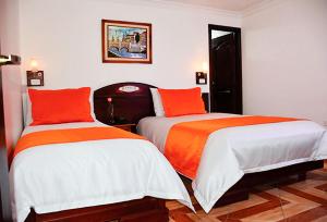 Postel nebo postele na pokoji v ubytování Hotel Plaza Victoria