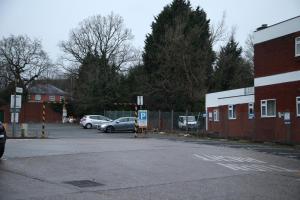 a parking lot with cars parked next to a building at The Hideaway in Birmingham