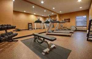 a gym with several tread machines and a treadmill at Best Western Plus Mishawaka Inn in South Bend