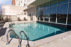 a swimming pool in front of a building at Drury Inn & Suites Cincinnati Sharonville in Sharonville