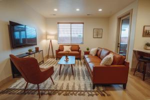 a living room with a couch and a table at Harper House in Santa Clara