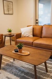 a living room with a couch and a coffee table at Harper House in Santa Clara +34 photos