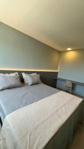 Una cama o camas en una habitación de Apartamento 2/4 no Francês