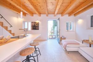 a living room with white walls and wooden ceilings at Heritage House in Historic Center of Split in Split