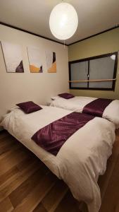En eller flere senge i et værelse på Hida Takayamasan no machi House - Vacation STAY 98088v