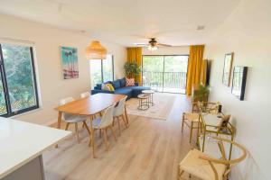 a living room with a table and chairs at Private Tropical Beach Oasis in Cape Canaveral