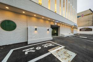 a parking lot in front of a building at Hey Gunsan Hotel in Gunsan-si