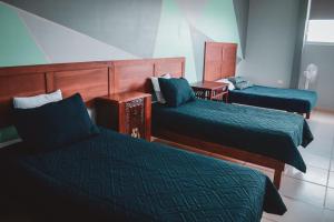 Rúm í herbergi á La Conspiración Hotel