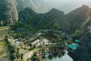 an aerial view of a resort in a mountain valley at Fairy Mountain Retreat in Ninh Binh