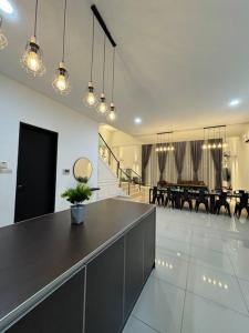 a large room with a table and a dining room at Private Pool Selangor Puchong Cyberjaya Putrajaya in Puchong