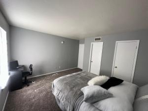 a bedroom with a bed and a desk at Cozy Private Master Bedroom Near 7th Street in Fort Worth