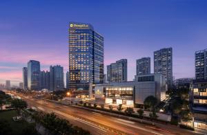 a city skyline with tall buildings and a freeway at Shangri-La Hefei in Hefei
