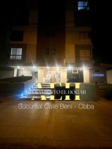 a building with lights in front of a building at El Hogar - Sucursal Calle Beni - Edificio Auriga 272 con Garaje cubierta in Cochabamba